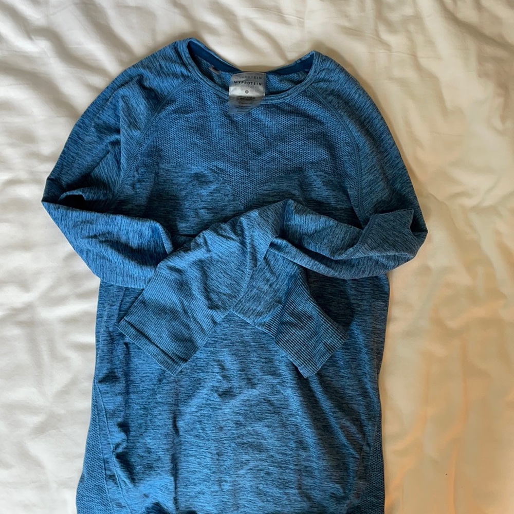 My Protein blue long sleeve workout top.